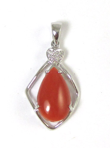 Appraisal: CORAL DIAMOND AND FOURTEEN KARAT WHITE GOLD PENDANT centering a