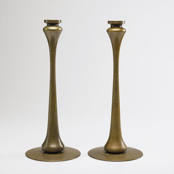 Appraisal: AURORA STUDIOS Jarvie style candlesticks of solid bronze with loose