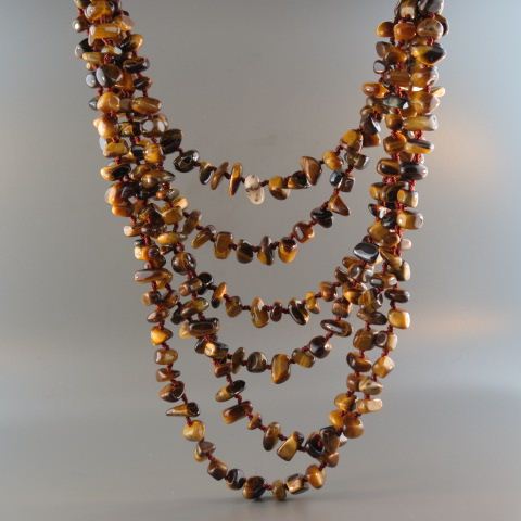 Appraisal: Tigerseye Necklace six strands of natural nuggets with large disc