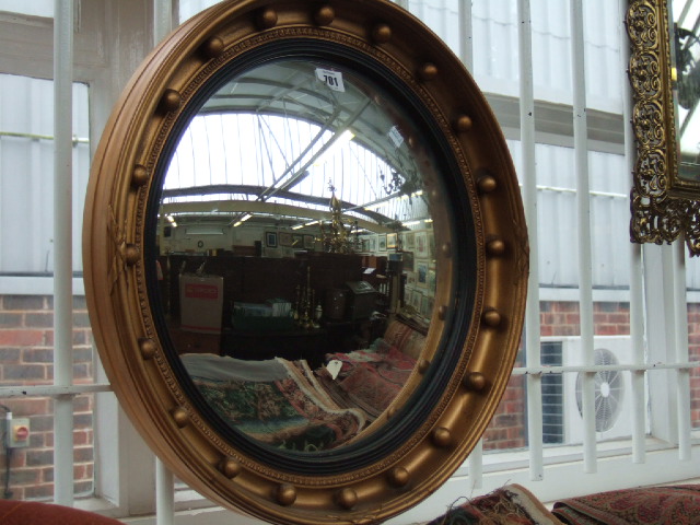 Appraisal: A Regency design convex wall mirror the circular gold painted