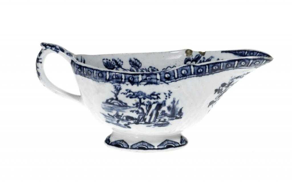 Appraisal: A DERBY SAUCE BOAT moulded with scrolling cartouches and transfer