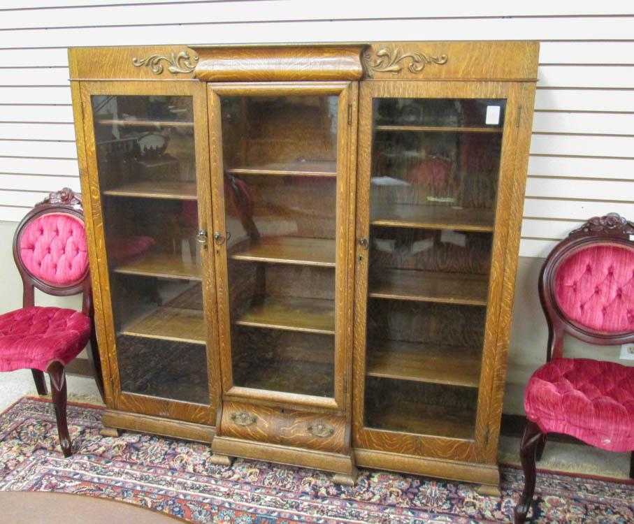 Appraisal: LATE VICTORIAN OAK CABINET BOOKCASE American c a breakfront design