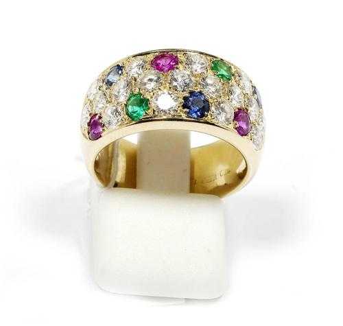 Appraisal: GEMSTONE AND BRILLIANT-CUT DIAMOND RING Yellow gold Broad band ring