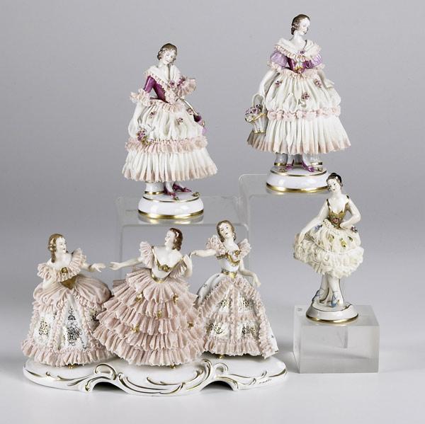 Appraisal: FOUR DRESDEN PORCELAIN FIGURINES A triple figure of dancing figures