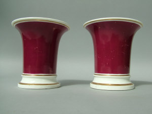 Appraisal: A pair of Rockingham flared spill vases maroon ground with