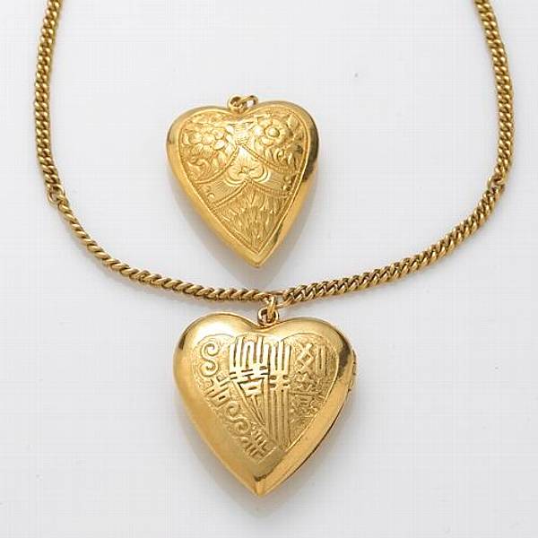 Appraisal: A collection of two k gold heart pendants and chain