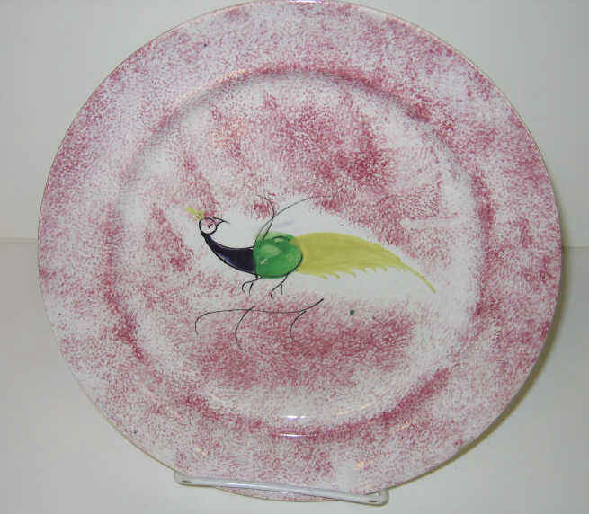 Appraisal: ENGLISH SPATTERWARE Red spatter Peafowl plate decorated in purple green