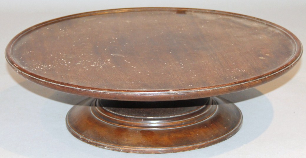 Appraisal: A thC mahogany Lazy Susan the circular top with a