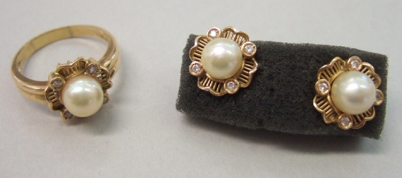 Appraisal: A gold cultured pearl and diamond set ring mounted with