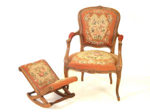 Appraisal: A Louis XVI style walnut tapestry upholstered fauteuil the foliate