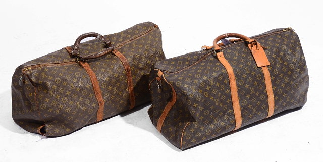 Appraisal: TWO LOUIS VUITTON TRAVELLING HOLDALLS with leather strap work and