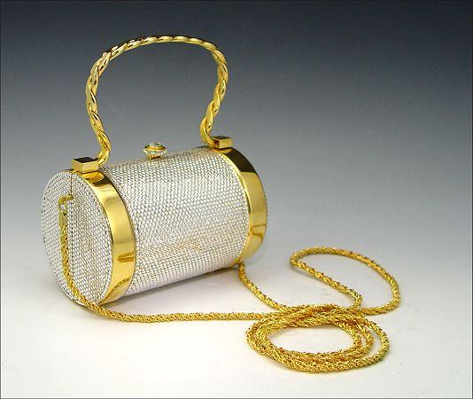 Appraisal: KATHRINE BAUMANN CRYSTAL STUDDED PURSE Cylindrical form with stationary bale