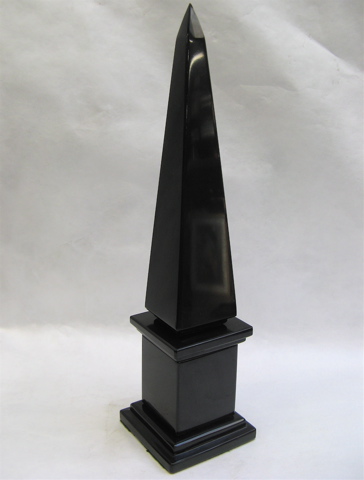 Appraisal: BLACK MARBLE SCULPTED OBELISK The tall slender four sided pillar