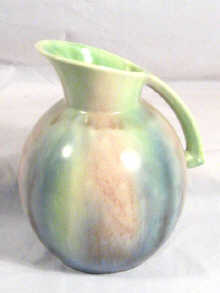 Appraisal: A Sylvac milk jug in matt glaze pastel colours impressed