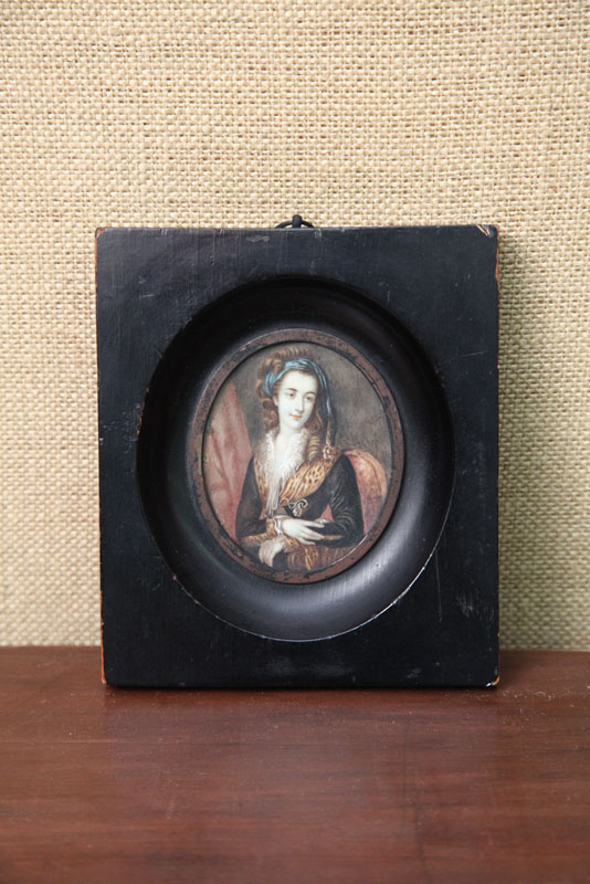 Appraisal: MINIATURE ON BONE Half length portrait of a lady wearing