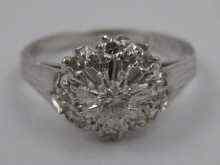 Appraisal: A white metal tests carat gold diamond cluster ring