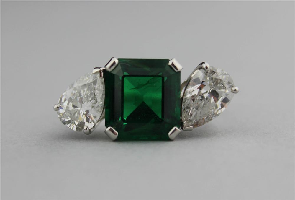 Appraisal: PLATINUM AND DIAMOND RING WITH A SYNTHETIC EMERALD synthetic emerald