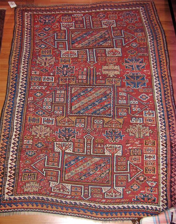 Appraisal: KURDISH antique Rust coloured central field with a geometric pattern