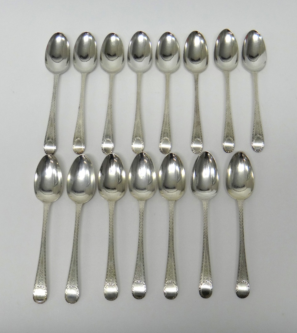 Appraisal: Fifteen silver dessert spoons bright cut Old English pattern comprising