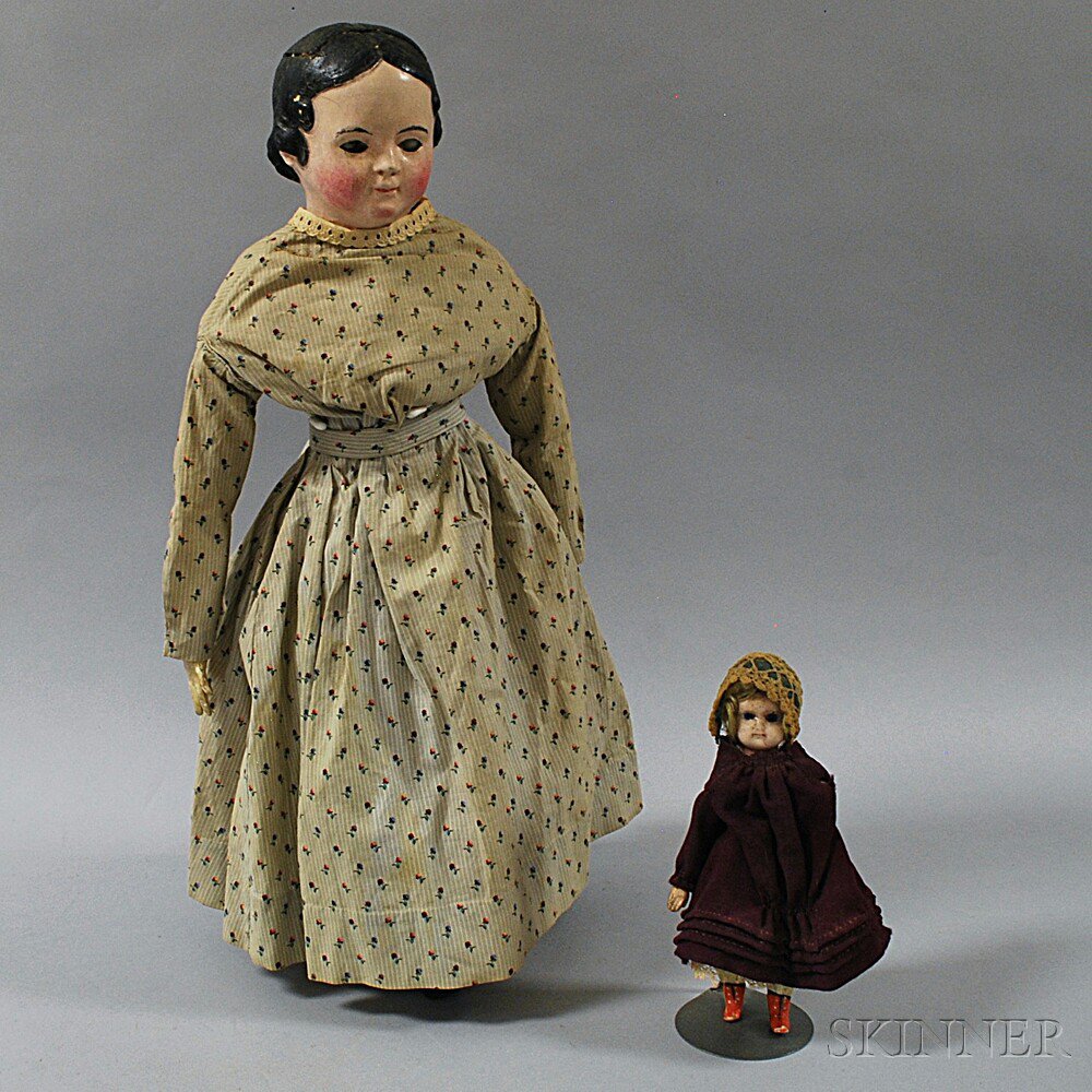 Appraisal: Two Dolls a small wax-over-composition shoulder head doll with inset