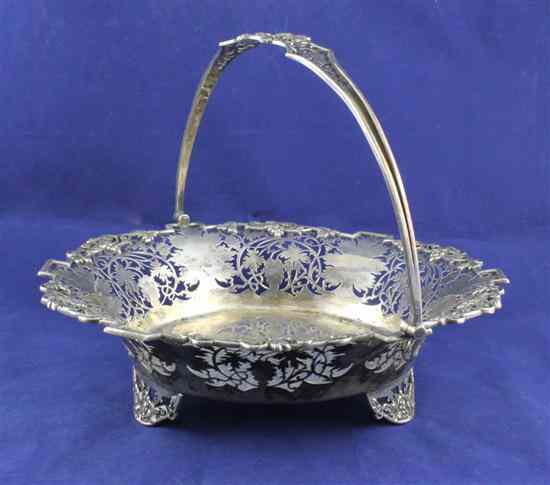 Appraisal: A 's silver cake basket of shaped circular form with