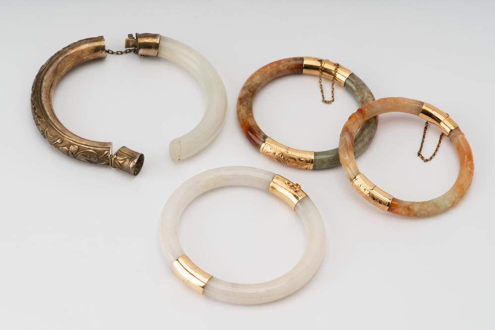 Appraisal: GROUP OF HARD STONE GOLD BANGLESIncluding a karat rose gold