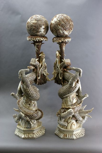 Appraisal: A pair of Chinese buffalo bone dragons modelled with water