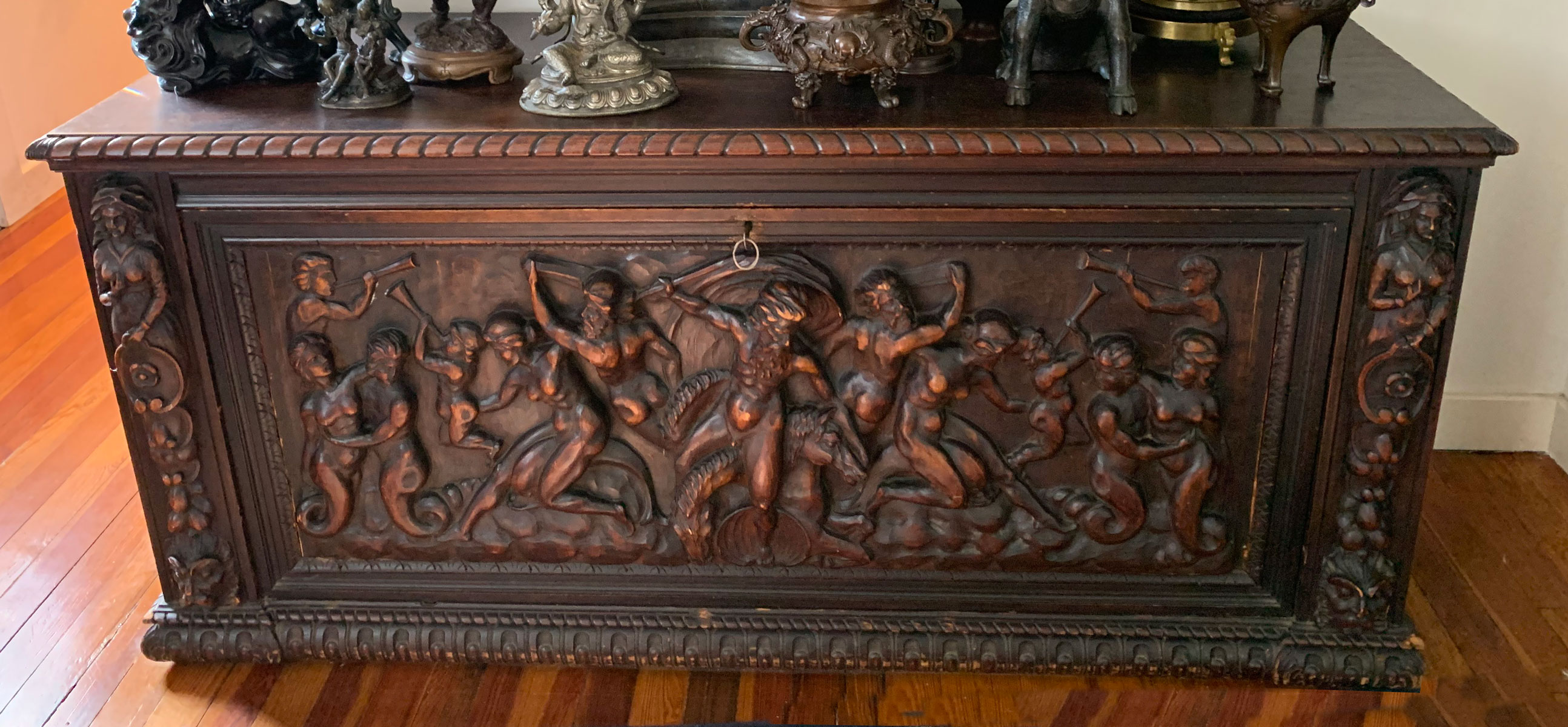 Appraisal: RELIEF CARVED CABINET Heavily carved scene with Nude Figures Horses