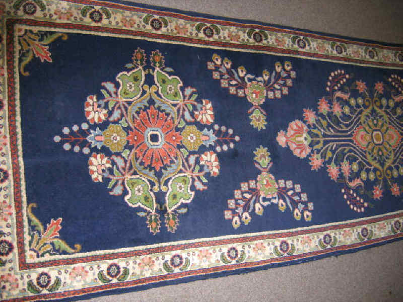 Appraisal: SAROUK DESIGN RUNNER The indigo field shows seven floral filigree