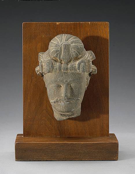 Appraisal: A Gandharan gray schist head Northwest India nd rd Century