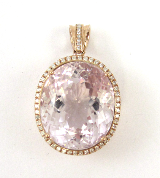 Appraisal: KUNZITE AND FOURTEEN KARAT ROSE GOLD PENDANT with round-cut diamonds