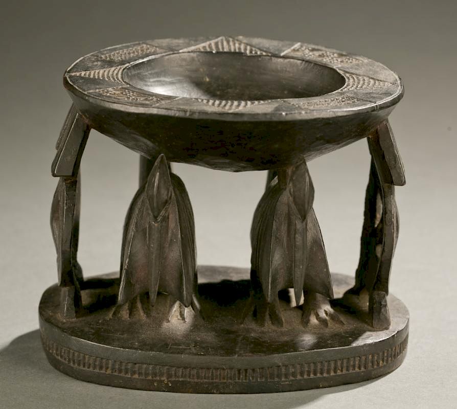 Appraisal: Caryatid kola nut bowl with birds th c A caryatid