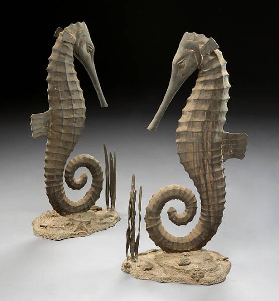 Appraisal: A pair of patinated bronze figures of seahorses Each modeled