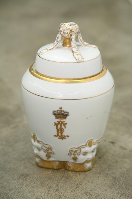 Appraisal: PORCELEIN COVERED JAR Figural base with gilt accents and gilt