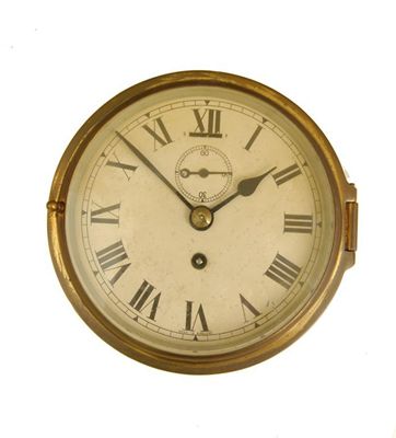 Appraisal: A gilt brass cased bulk head type wall clock the