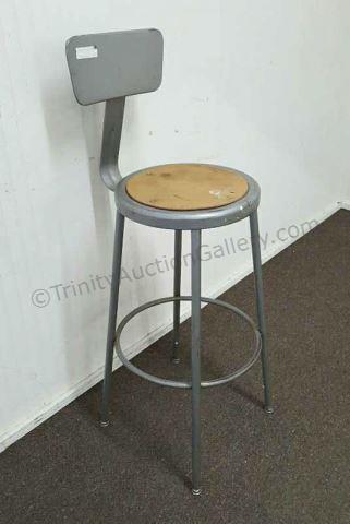 Appraisal: Steel construction shop stool with pressed board seat and spring