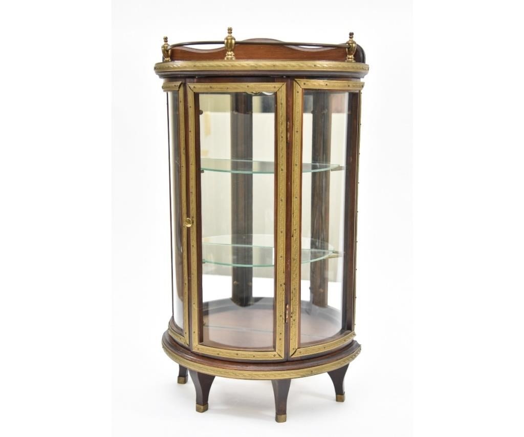 Appraisal: French style mahogany glass front miniature bow-front china cabinet circa