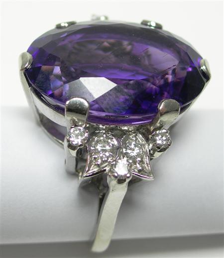 Appraisal: An amethyst and diamond cocktail ring claw set with a