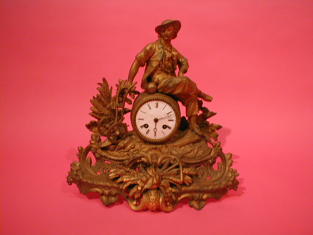 Appraisal: A thC French gilt metal figural mantel clock with eight