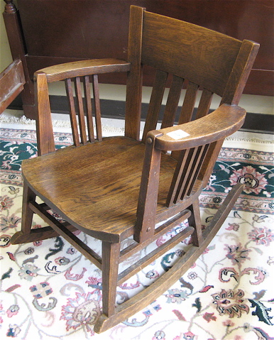 Appraisal: ARTS CRAFTS ROCKING OAK ARMCHAIR American c having a low