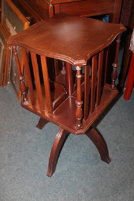 Appraisal: A MAHOGANY REVOLVING BOOK STAND on reeded supports across