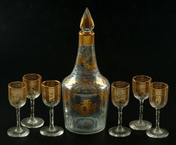 Appraisal: A Continental flat-cut mallet-shaped decanter and faceted stopper gilt with