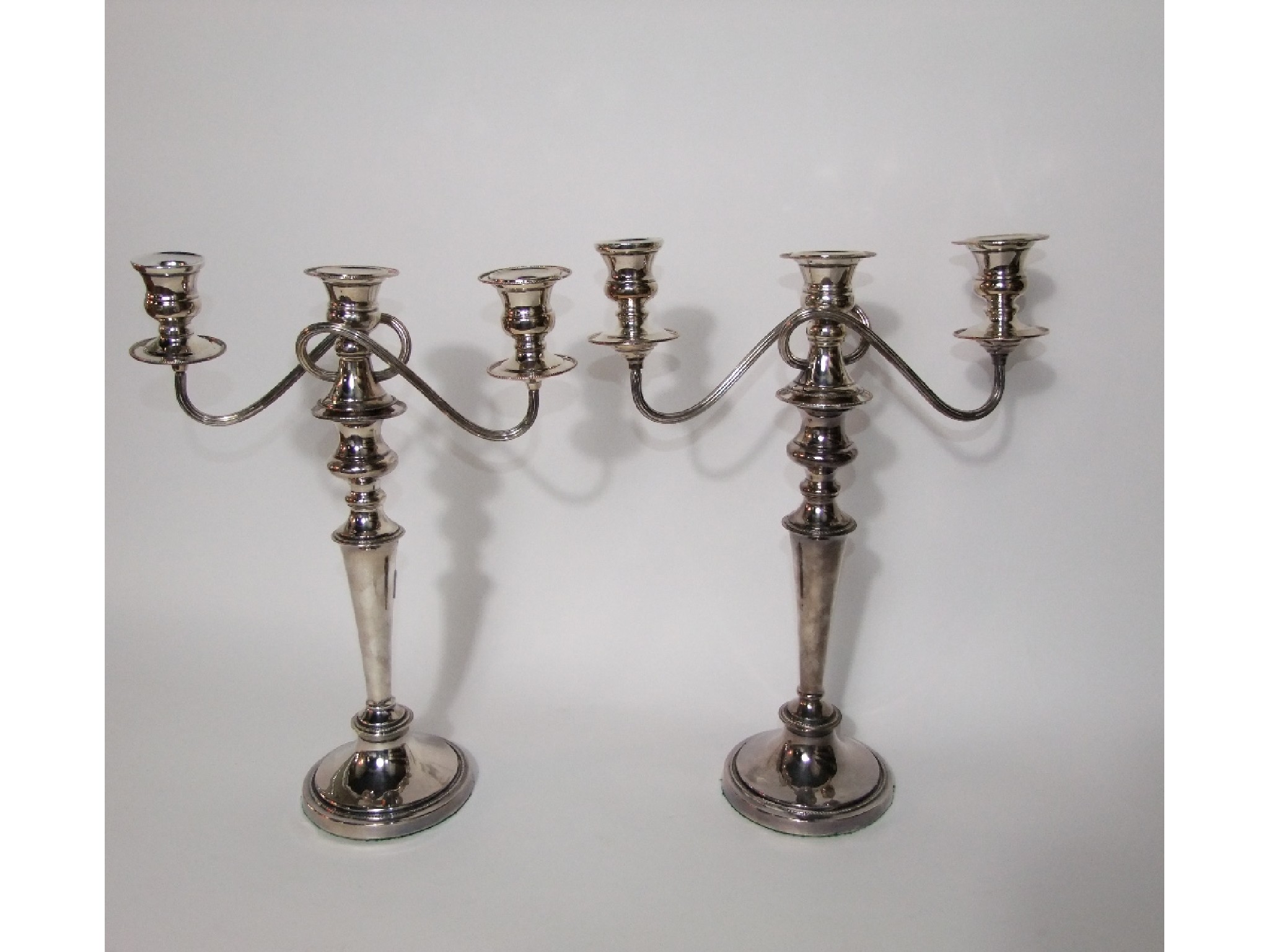 Appraisal: A pair of silver plated three divisonal candleabra each with