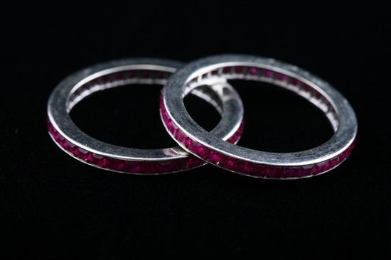 Appraisal: PAIR WHITE GOLD AND RUBY GUARD RINGS Each with circle