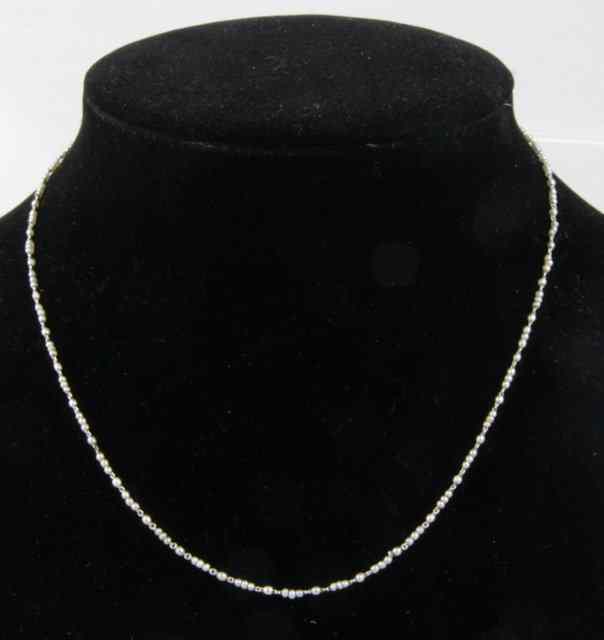 Appraisal: A seed pearl and platinum necklet cm long