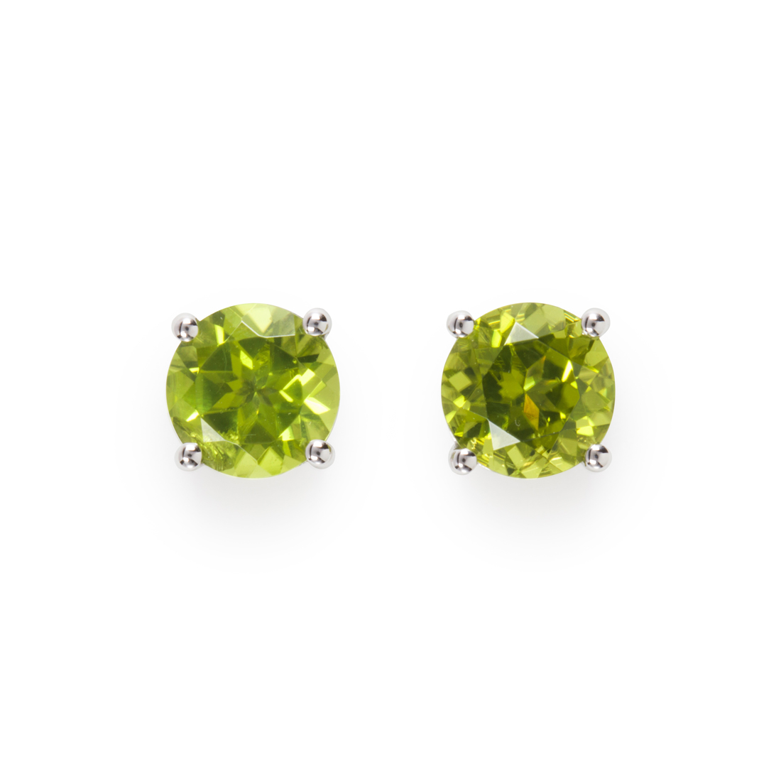 Appraisal: A PAIR OF PERIDOT AND FOURTEEN KARAT WHITE GOLD STUD