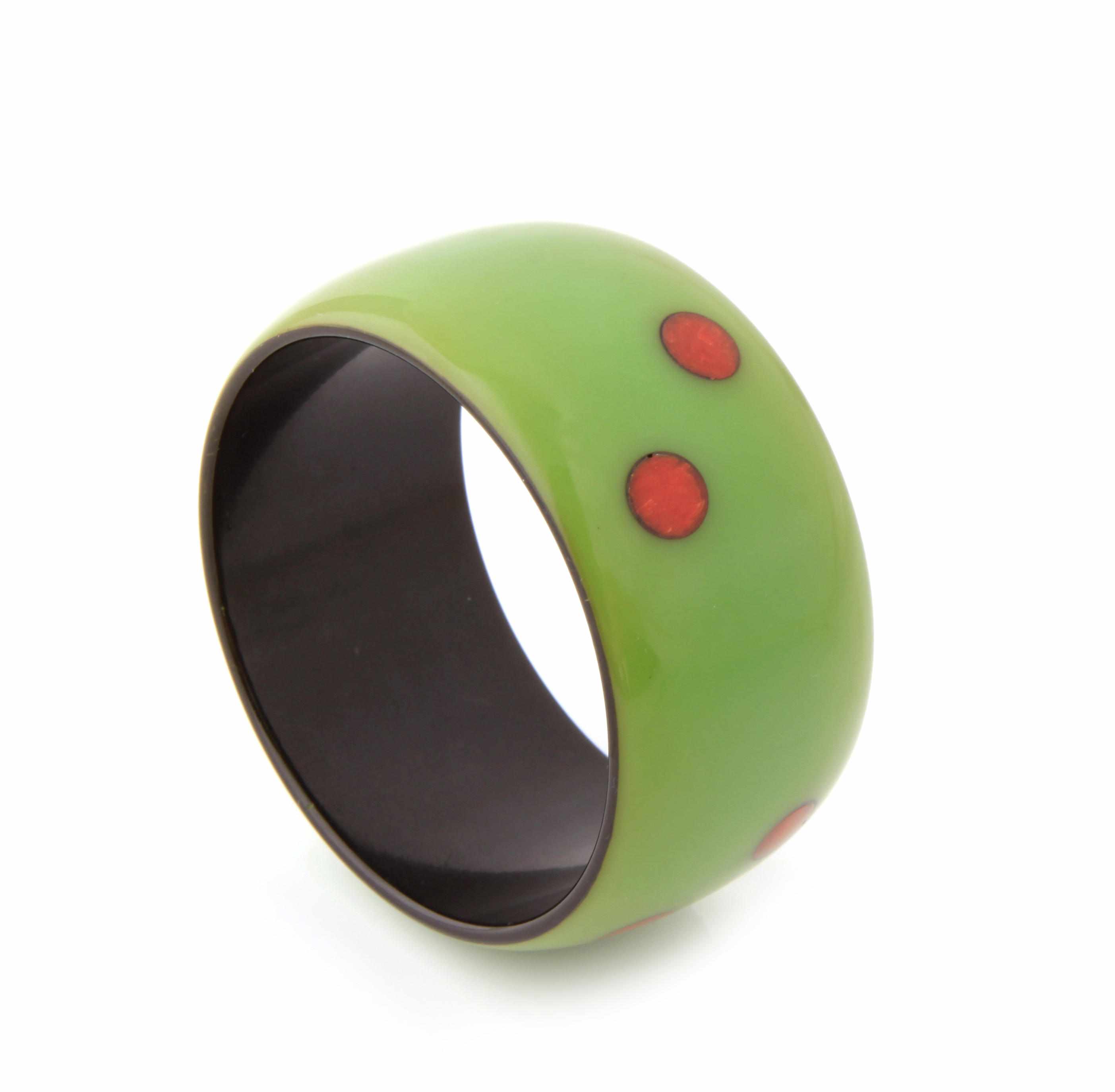 Appraisal: A cast dye injected Bakelite ''dot'' bangle bracelet diameter in