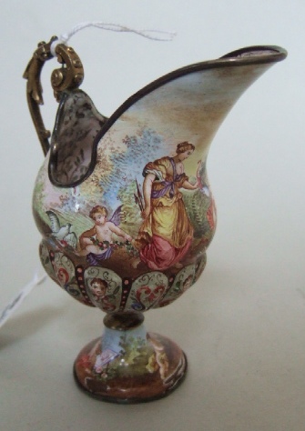 Appraisal: A small silver-gilt mounted Viennese enamelled ewer with the mark