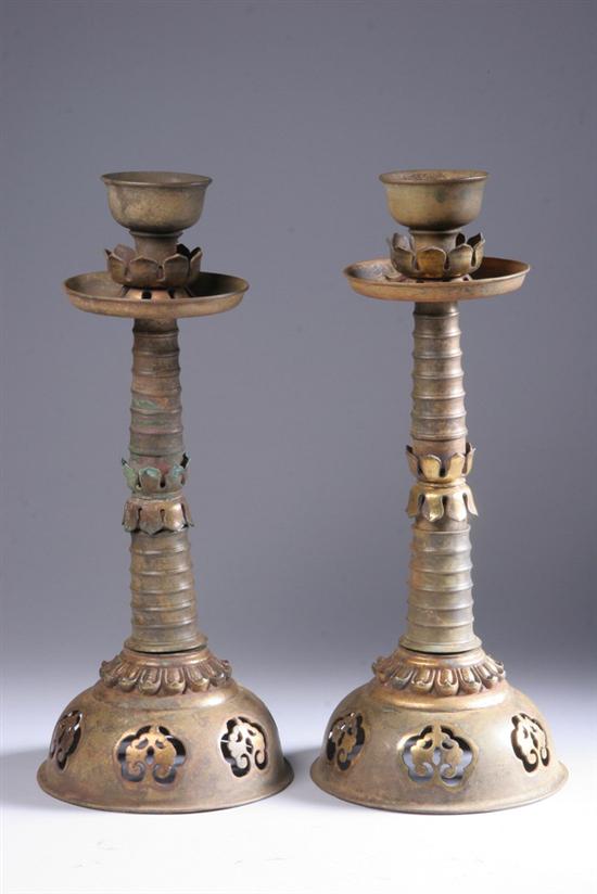 Appraisal: PAIR CHINESE GILT BRONZE OIL LAMPS Tang Dynasty Domed foot