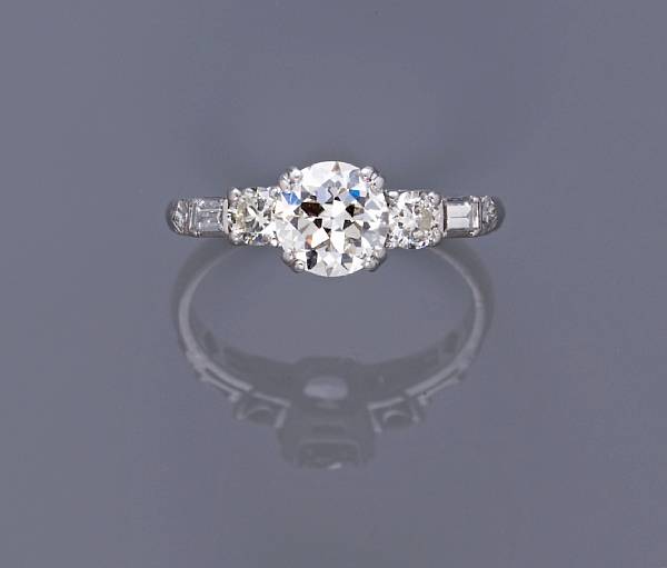 Appraisal: A diamond ring centering a transitional-cut diamond principal diamond weighing